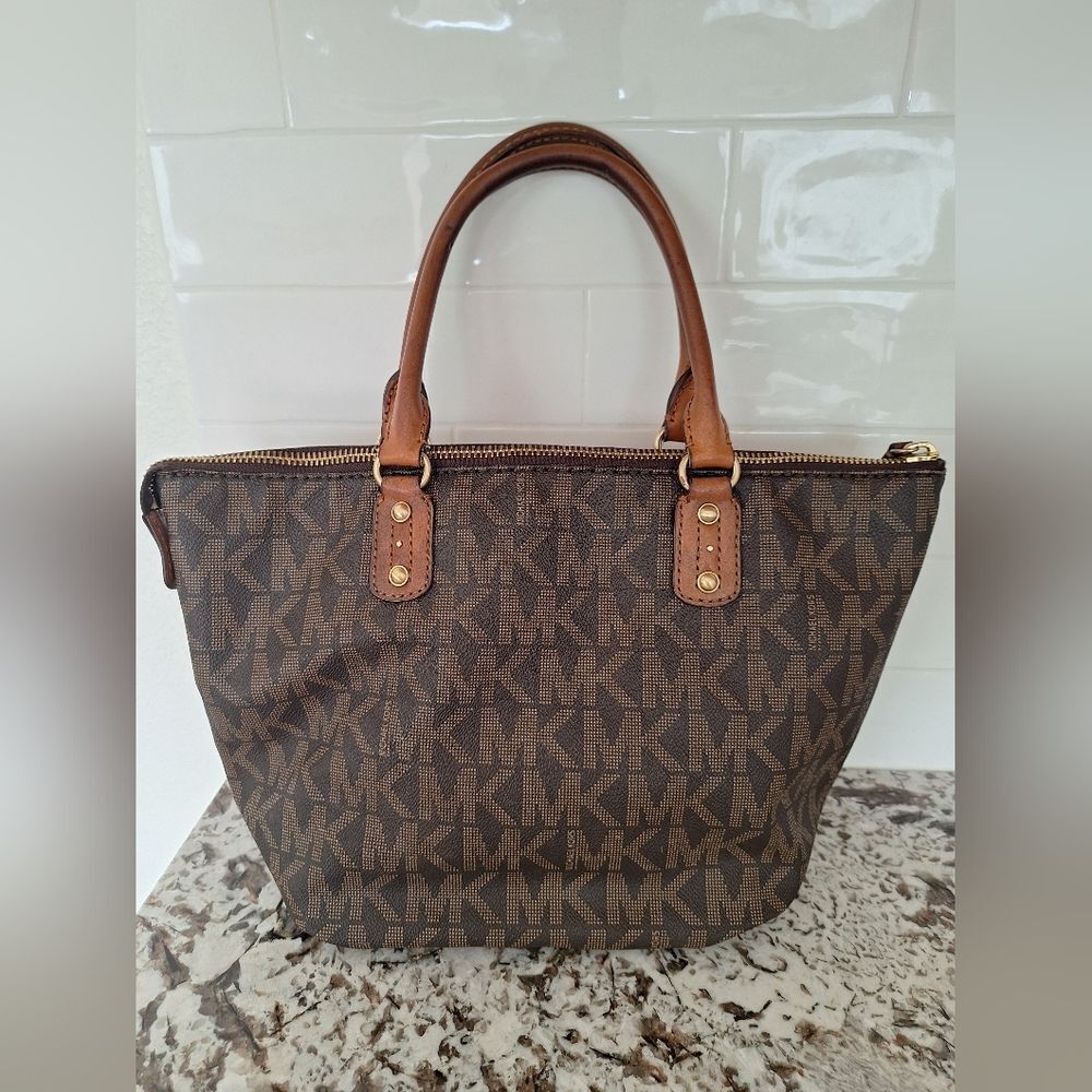 Michael Kors brown leather logo tote bag.